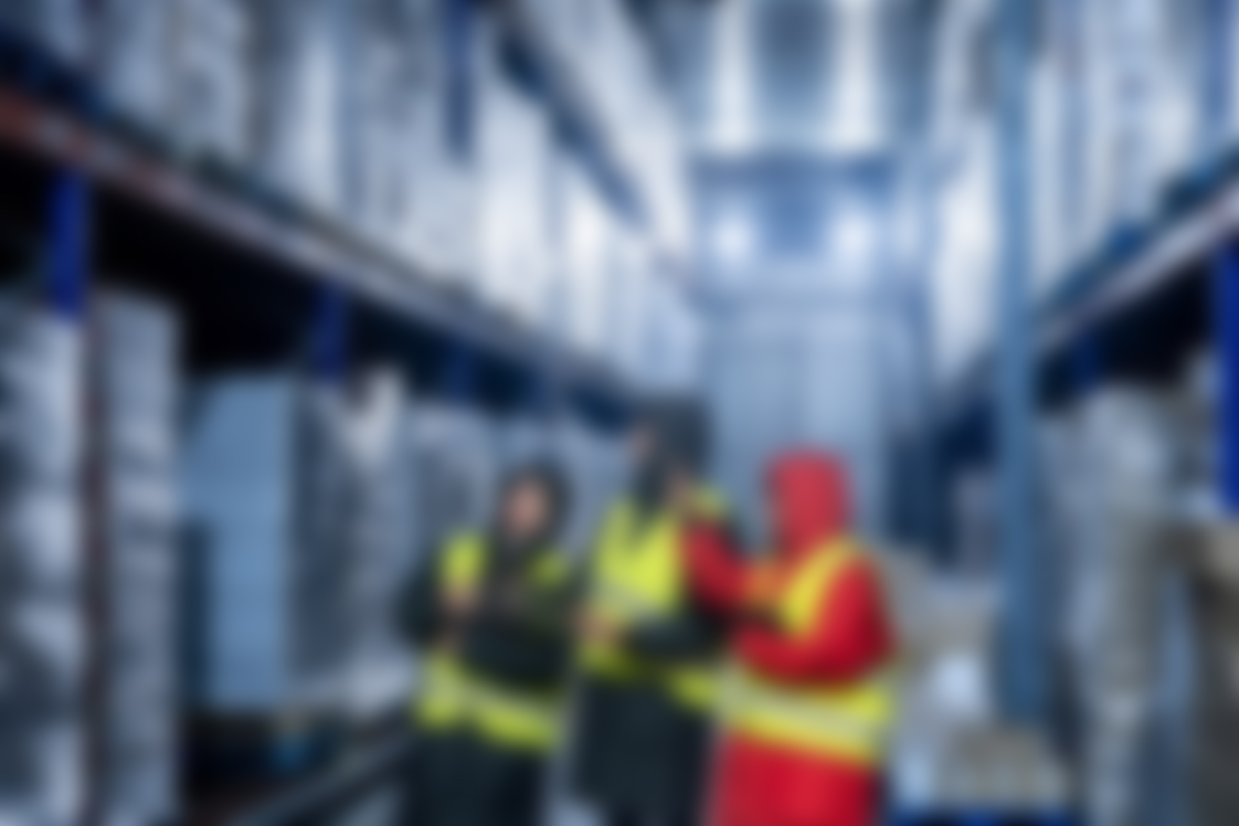 Logistics,Team,Members,In,Protective,Clothing,And,High,Visibility,Vests